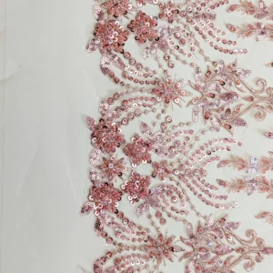 Pizzo con paillettes motivo fiori rosa