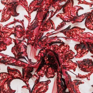 Pizzo con paillettes motivo fiori rosse