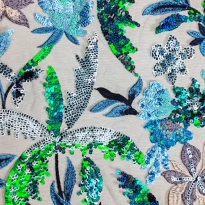 Pizzo con paillettes motivo fiori fra verde e blu